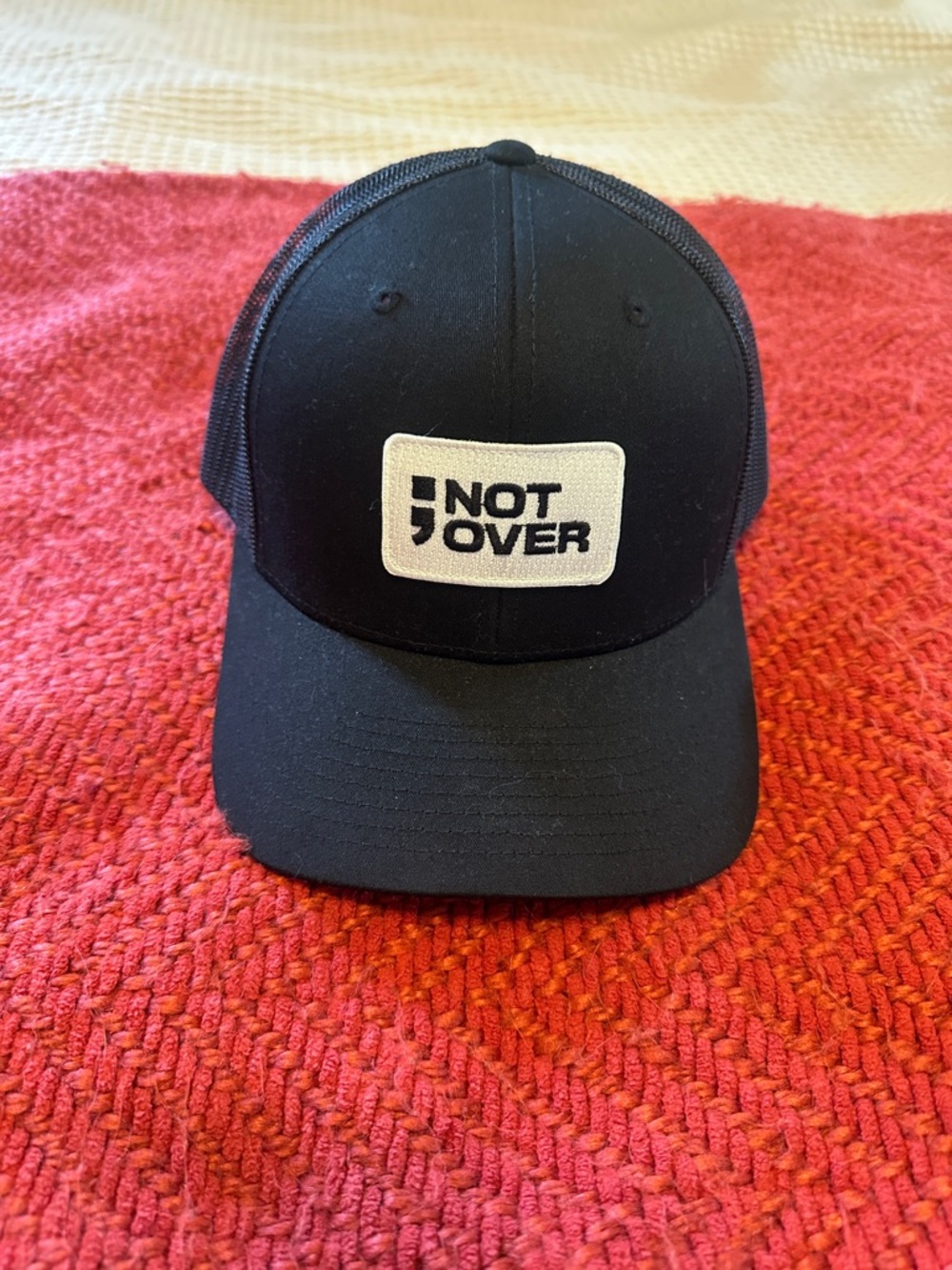 Black Trucker Hat with 'NOT OVER' Patch